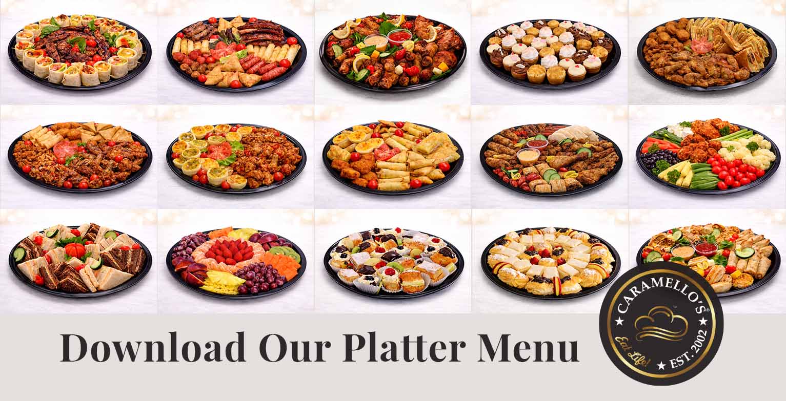 Assorted catering platters featuring sandwiches, wraps, grilled meats, pastries, and fresh fruit.